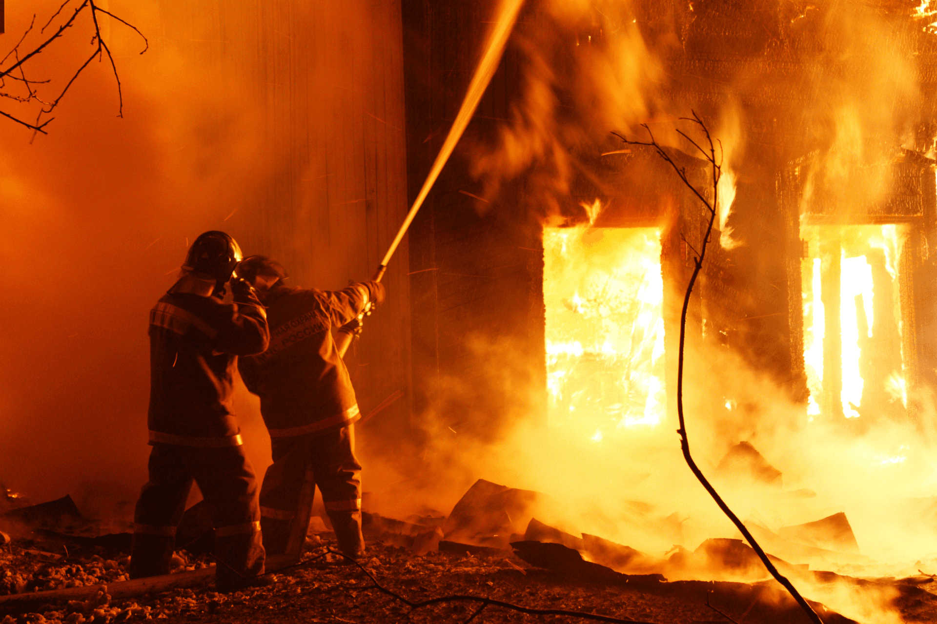 Firefighters facing a building fire
